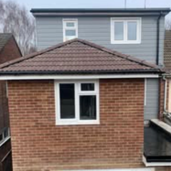 an extension to rear of house, grey cladding